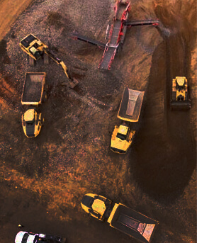 A group of trucks working in a minefield.